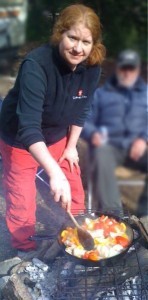 Elaine McCarthy cooking over an open camp fire. Elaine McCarthy cooking over an open camp fire.