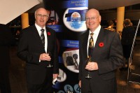 Paul and John Downs at the Telecommunications Hall of Fame. In 2009, they received the Hall of Fame's Career Service Award. In 2011, Paul was appointed to the Hall of Fame Foundation's board of governors. (Photo: Nexicom) Paul and John Downs at the Telecommunications Hall of Fame. In 2009, they received the Hall of Fame's Career Service Award. In 2011, Paul was appointed to the Hall of Fame Foundation's board of governors. (Photo: Nexicom)
