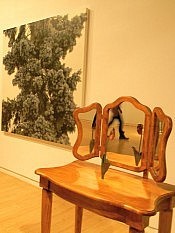 Large, hyperrealistic oil-on-canvas works of foliage dominate the large open space Large, hyperrealistic oil-on-canvas works of foliage dominate the large open space