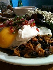 Black bean enchiladas topped with sour cream, salsa, and a fried egg (photo: Planet Bakery) Black bean enchiladas topped with sour cream, salsa, and a fried egg (photo: Planet Bakery)