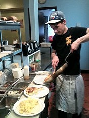 Employee Ben Tyne preparing omelettes, which The Planet serves throughout the day (photo: Carol Lawless) Employee Ben Tyne preparing omelettes, which The Planet serves throughout the day (photo: Carol Lawless)