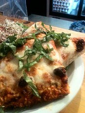 The Planet serves a variety of dishes, like this Margarita pizza with fresh basil (photo: Planet Bakery) The Planet serves a variety of dishes, like this Margarita pizza with fresh basil (photo: Planet Bakery)