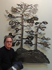The artist poses next to one of the larger custom editions of his windswept pines (photo: David Hickey) The artist poses next to one of the larger custom editions of his windswept pines (photo: David Hickey)