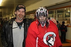 Joe Mead with goalie Criss in a helmet that Joe designed and airbrushed