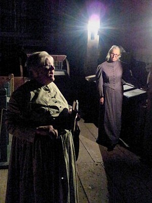 Lang volunteers Julia Gregory and Audrey Caryi guide visitors through the village at night, while telling stories of Peterborough's past in an informative and gossipy way (photo: Sam Tweedle)