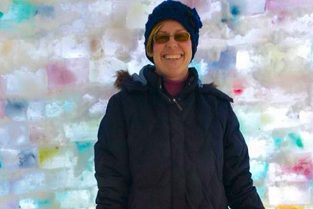 Organizer Carolyn Amyotte enjoying a quiet moment in the completed igloo