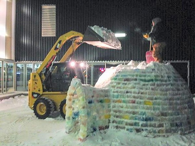 Adding more snow inside the igloo to reinforce the final rows