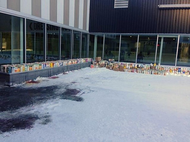 Preparing the cartons for filling with coloured water