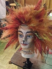 One of the 23 wigs used for the actors' costumes