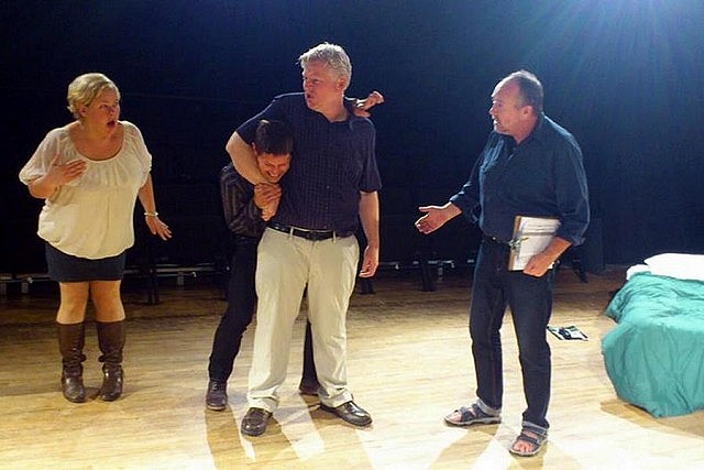 James Barrett has Jeff Gruich in a headlock as Sarah Quick and Mark Whelan look on. You'll have to see "No Tell Motel" to find out why.