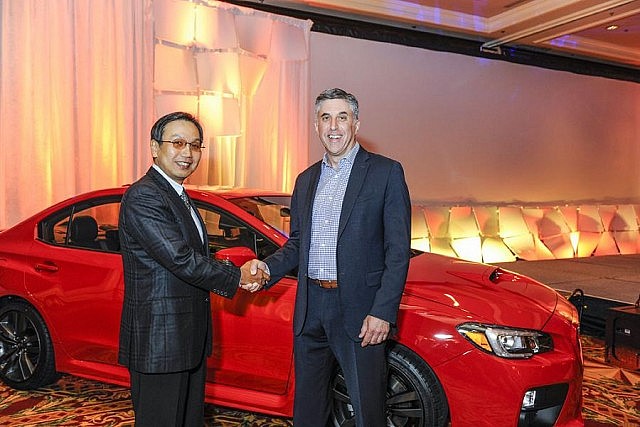 Shiro Ohta, chairman, president and CEO of Subaru Canada, shakes hands with Steve Carli, president of Red Urban, earlier this year after the company was selected as the brand's agency of record