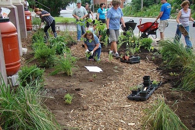 The conversion of asphalt-covered spaces into of more permeable surfaces is one way to allow rainwater to soak into the ground and divert it from nearby storm drains