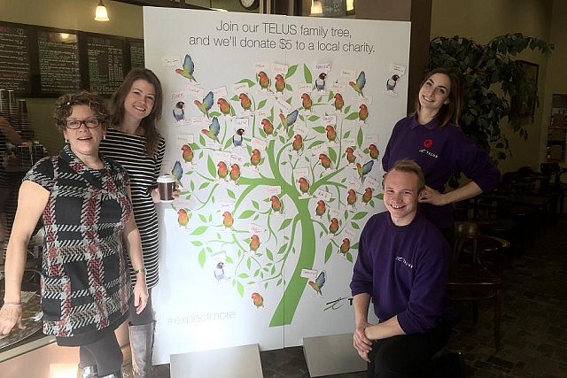 Members of the TELUS Care-A-Van team, GreenUP staff, and the owner of the Turnbull Café enjoy free coffee at the downtown coffee shop, courtesy of TELUS