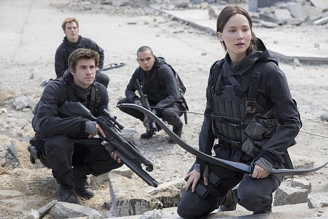 Liam Hemsworth as Gale Hawthorn with Jennifer Lawrence as Katniss Everdeen
