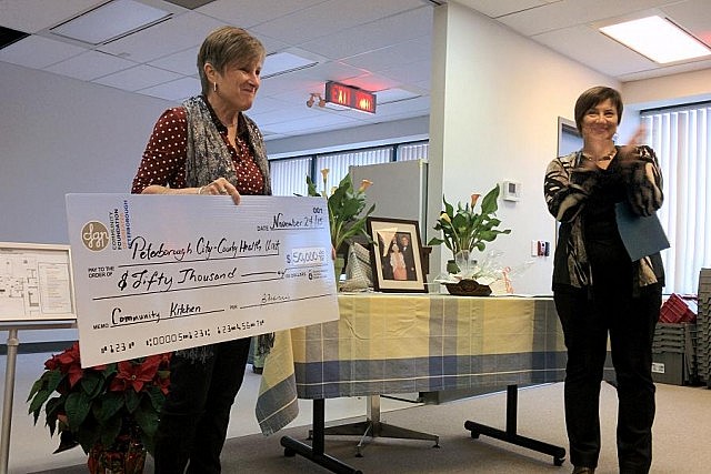 Community Foundation of Greater Peterborough Board chair Betty Morris presents the Peterborough County-City Health Unit with a cheque for $50,000 for Myrtle's Kitchen.