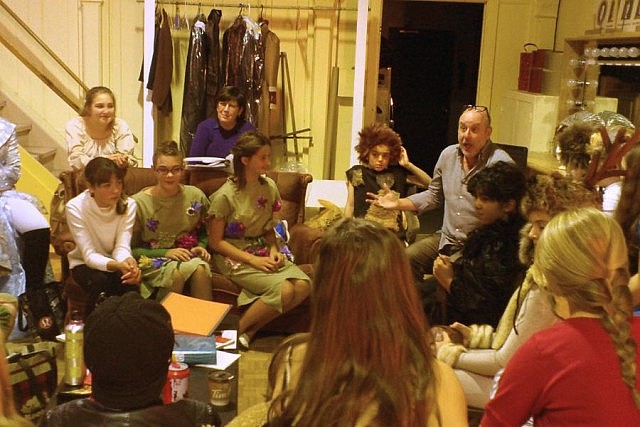 Director Charles Shamess with the cast during a group talk