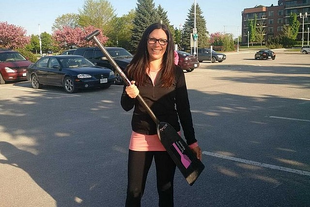 Michelle Thorton with her Survivors Abreast paddle. She will be paddling again in the 2016 Peterborough's Dragon Boat Festival, the proceeds of which will support the purchase of three new state-of-the-art full field digital mammography machines at PRHC's Breast Assessment Centre. (Photo: Sally Bell)