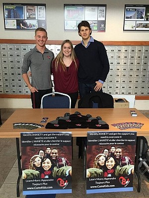 Kyle and Vanessa, two Cam Kid's Ambassadors, with Cam's brother Andrew sharing information at the University of Ottawa (photo courtesy of Cam's Kids)